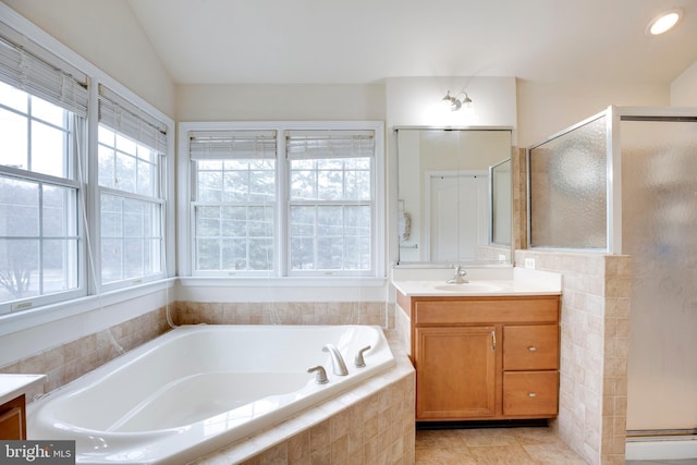 bathroom with vanity, shower with separate bathtub, and tile patterned floors