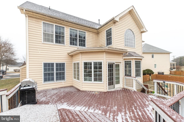 rear view of house with a wooden deck