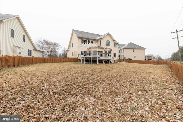 back of house featuring a deck