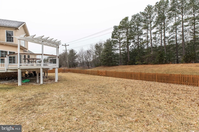 view of yard featuring a pergola and a wooden deck