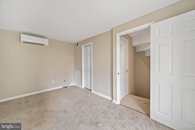 unfurnished bedroom featuring a wall mounted air conditioner, carpet flooring, and a closet