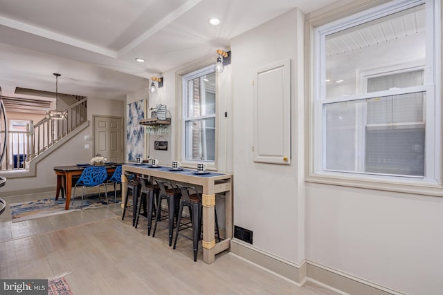 dining room featuring stairs, recessed lighting, light wood-style flooring, and baseboards