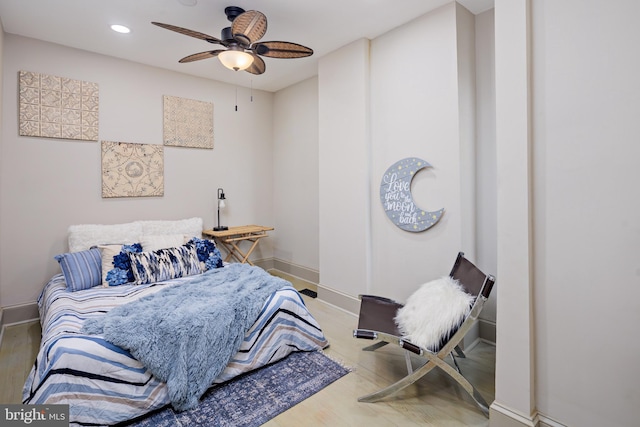 bedroom featuring baseboards, wood finished floors, a ceiling fan, and recessed lighting