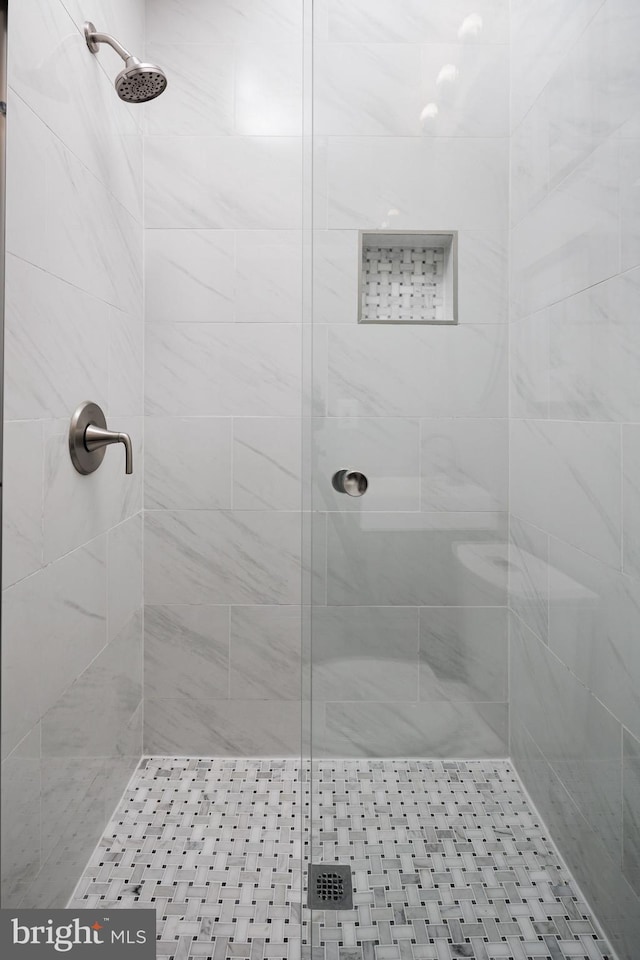 bathroom with a shower stall