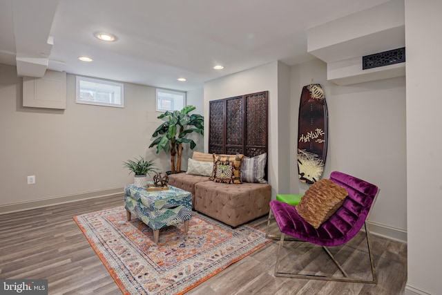 sitting room with recessed lighting, baseboards, and wood finished floors