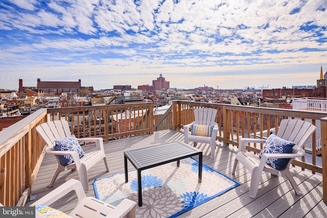 wooden terrace featuring a city view