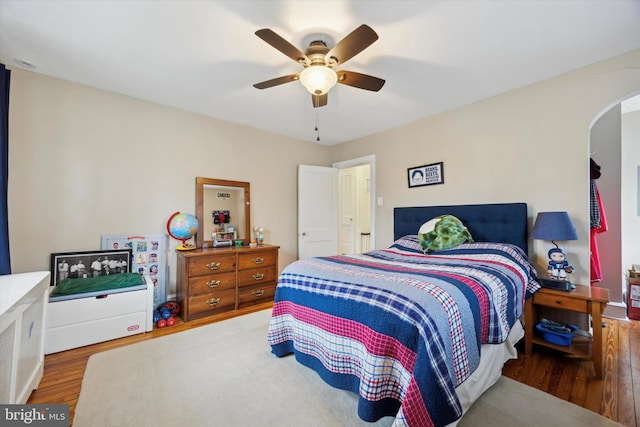 bedroom featuring hardwood / wood-style floors and ceiling fan