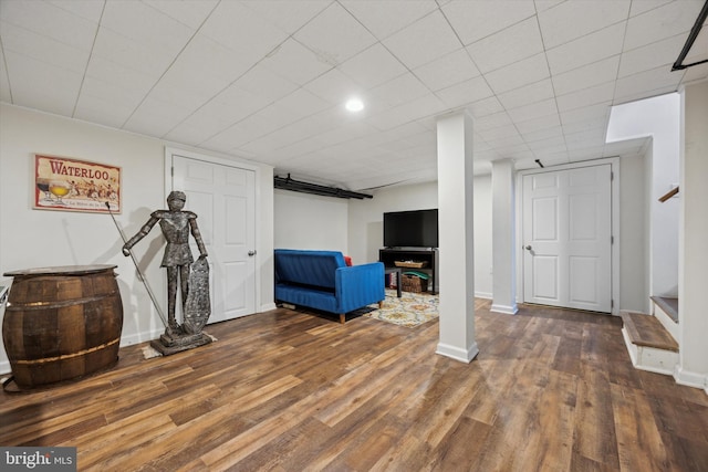 basement featuring dark hardwood / wood-style floors