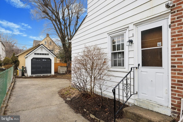 view of property exterior with an outbuilding and a garage