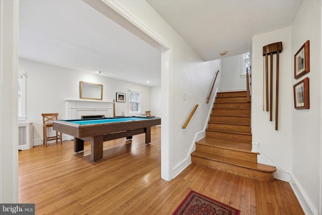 recreation room with pool table and light hardwood / wood-style flooring