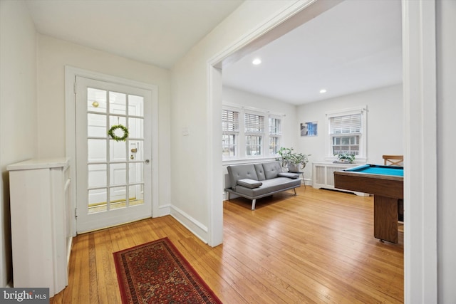 entrance foyer featuring billiards and light wood-type flooring