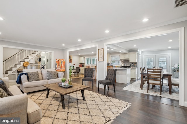 living room featuring recessed lighting, visible vents, stairway, dark wood finished floors, and crown molding