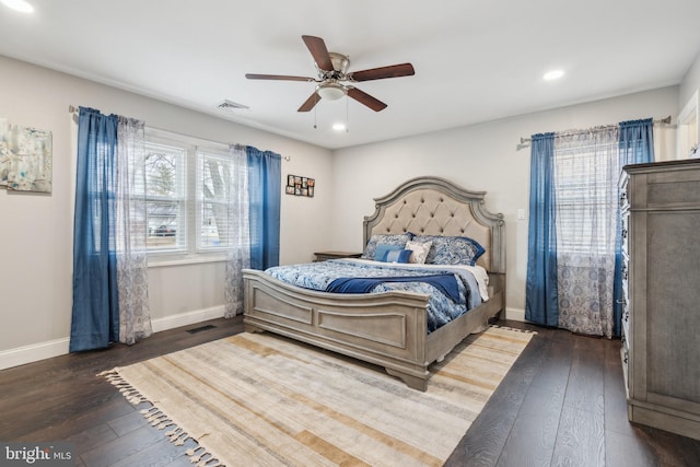 bedroom featuring baseboards, visible vents, and hardwood / wood-style floors