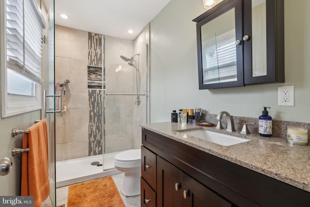 full bathroom with toilet, tile patterned floors, vanity, a shower stall, and recessed lighting