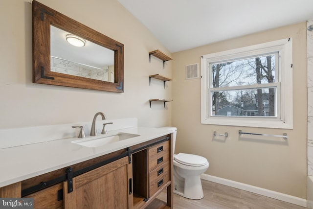 full bathroom with baseboards, visible vents, a shower, toilet, and vanity