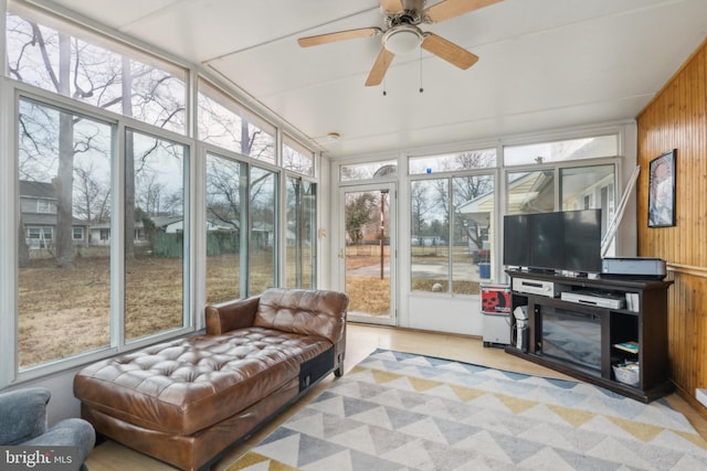 sunroom / solarium featuring vaulted ceiling and a ceiling fan