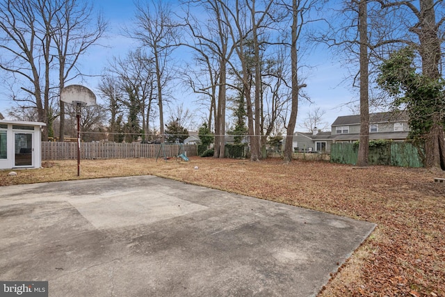 view of yard featuring fence private yard and a playground