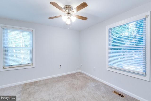 12452 White Horse Rd, Lusby, MD 20657 - empty room with visible vents, baseboards, carpet, and a ceiling fan