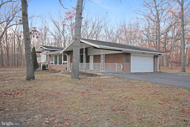 view of front facade with a garage and a porch