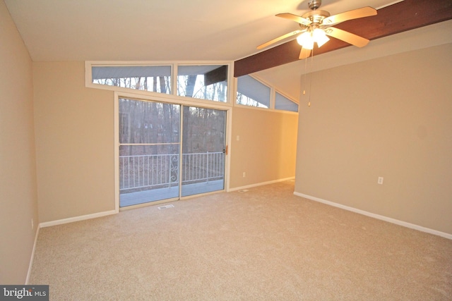 carpeted spare room with vaulted ceiling with beams and ceiling fan