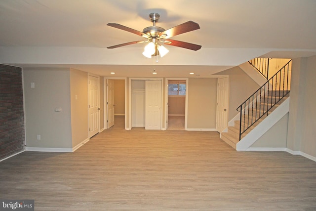 unfurnished living room with hardwood / wood-style floors and ceiling fan