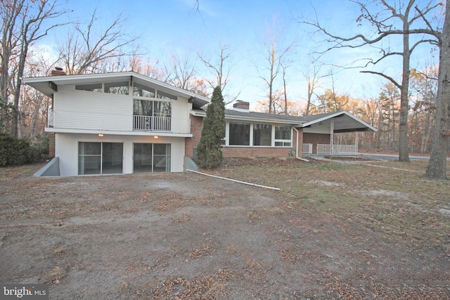 back of property featuring a garage