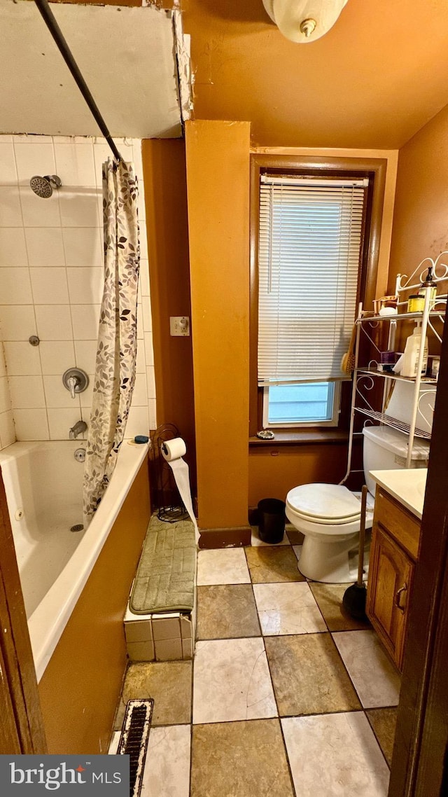 full bathroom featuring vanity, toilet, and shower / bath combo with shower curtain