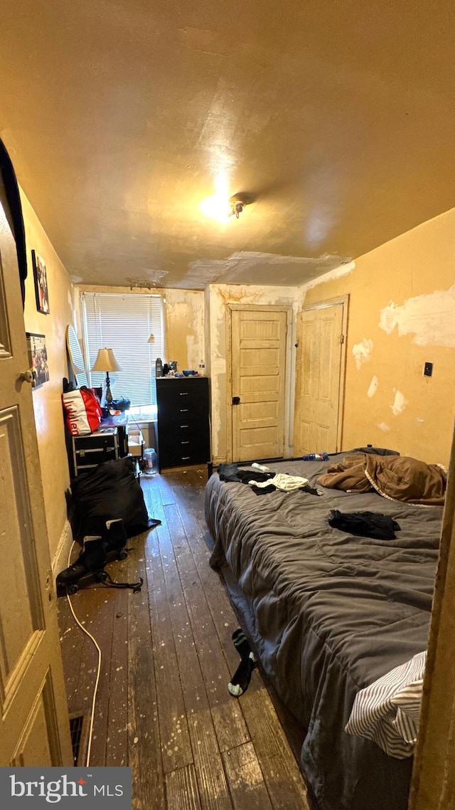 bedroom featuring dark hardwood / wood-style floors