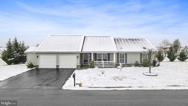 view of front facade with a garage and covered porch