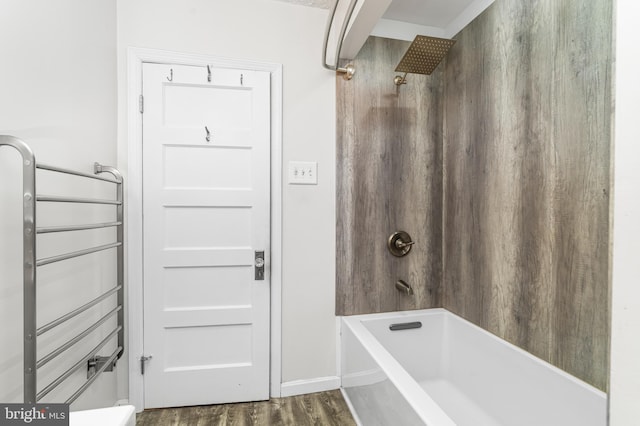 full bath featuring bathtub / shower combination and wood finished floors