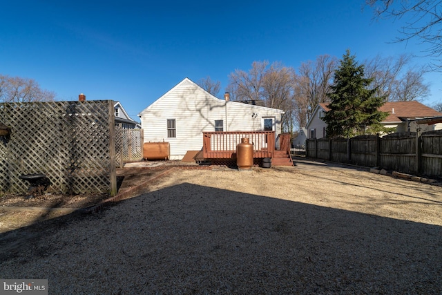 view of yard with a deck and fence