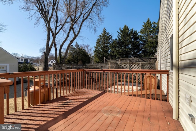 deck with a fenced backyard