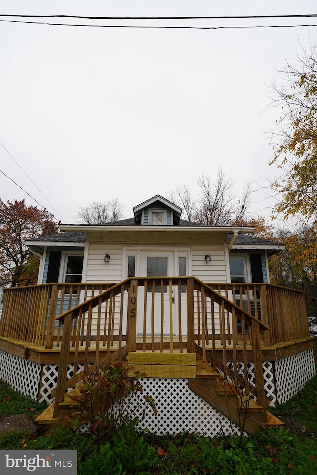 back of property featuring a deck