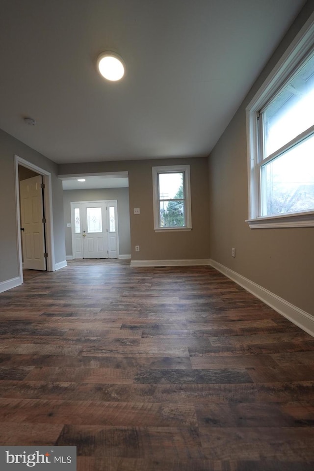 empty room featuring dark hardwood / wood-style floors