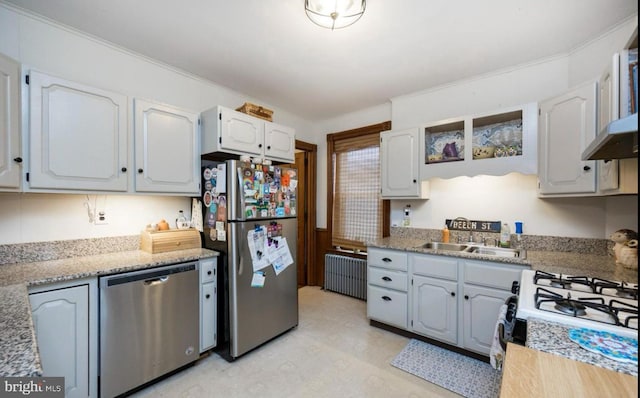 kitchen featuring radiator, sink, white cabinetry, stainless steel appliances, and ornamental molding