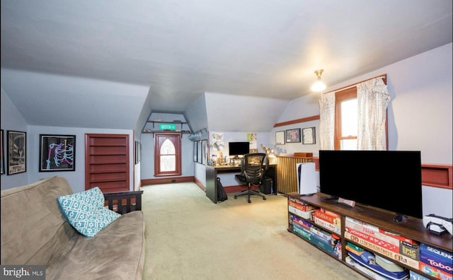 carpeted office space with lofted ceiling