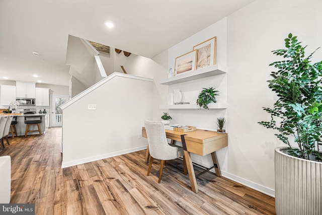 dining space featuring light hardwood / wood-style floors