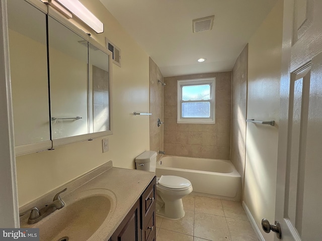 full bathroom with tile patterned floors, toilet, tiled shower / bath combo, and vanity