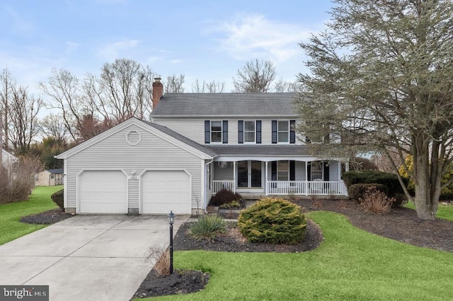 view of front of house with a porch, an attached garage, concrete driveway, a front lawn, and a chimney