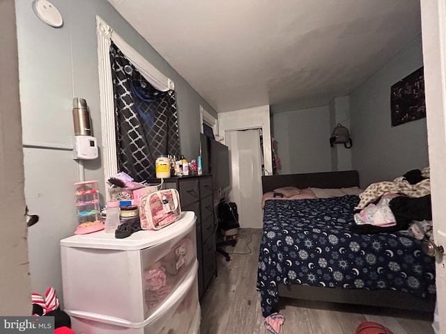 bedroom featuring hardwood / wood-style flooring