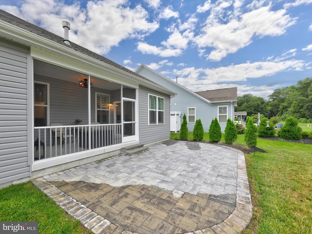 view of patio featuring a sunroom