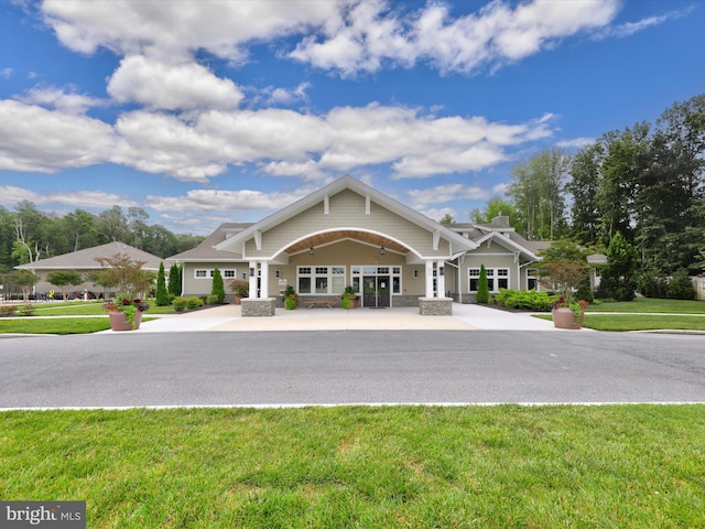 craftsman-style house with a front yard