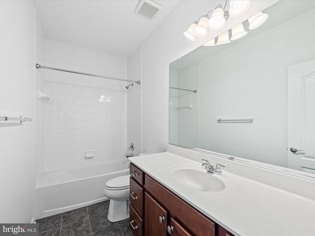 bathroom featuring visible vents, toilet, tile patterned floors, vanity, and shower / washtub combination