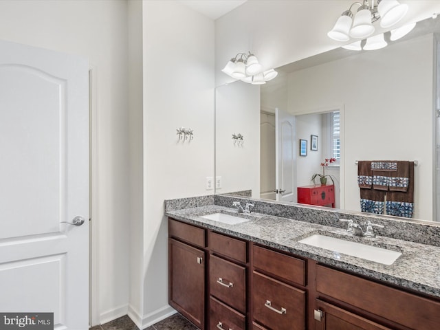 bathroom featuring double vanity and a sink