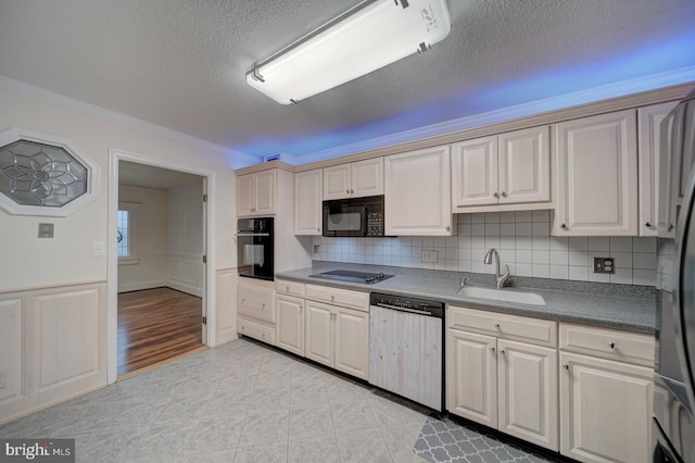 kitchen featuring sink, crown molding, tasteful backsplash, a textured ceiling, and black appliances