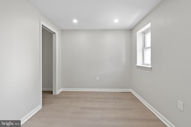 spare room featuring light hardwood / wood-style floors