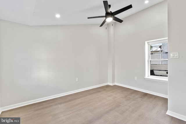 empty room with hardwood / wood-style flooring and ceiling fan