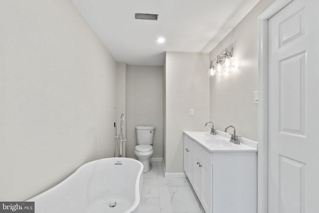 bathroom featuring vanity, a tub, and toilet