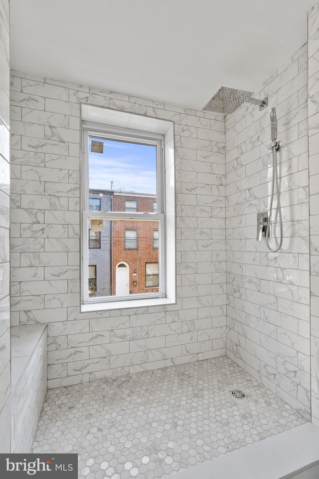 bathroom featuring tiled shower