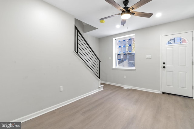 entryway with ceiling fan and light wood-type flooring